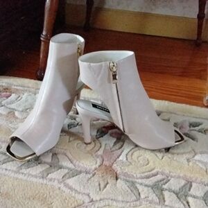 Elegant Cream Peep-Toe Ankle Boots made by dkny